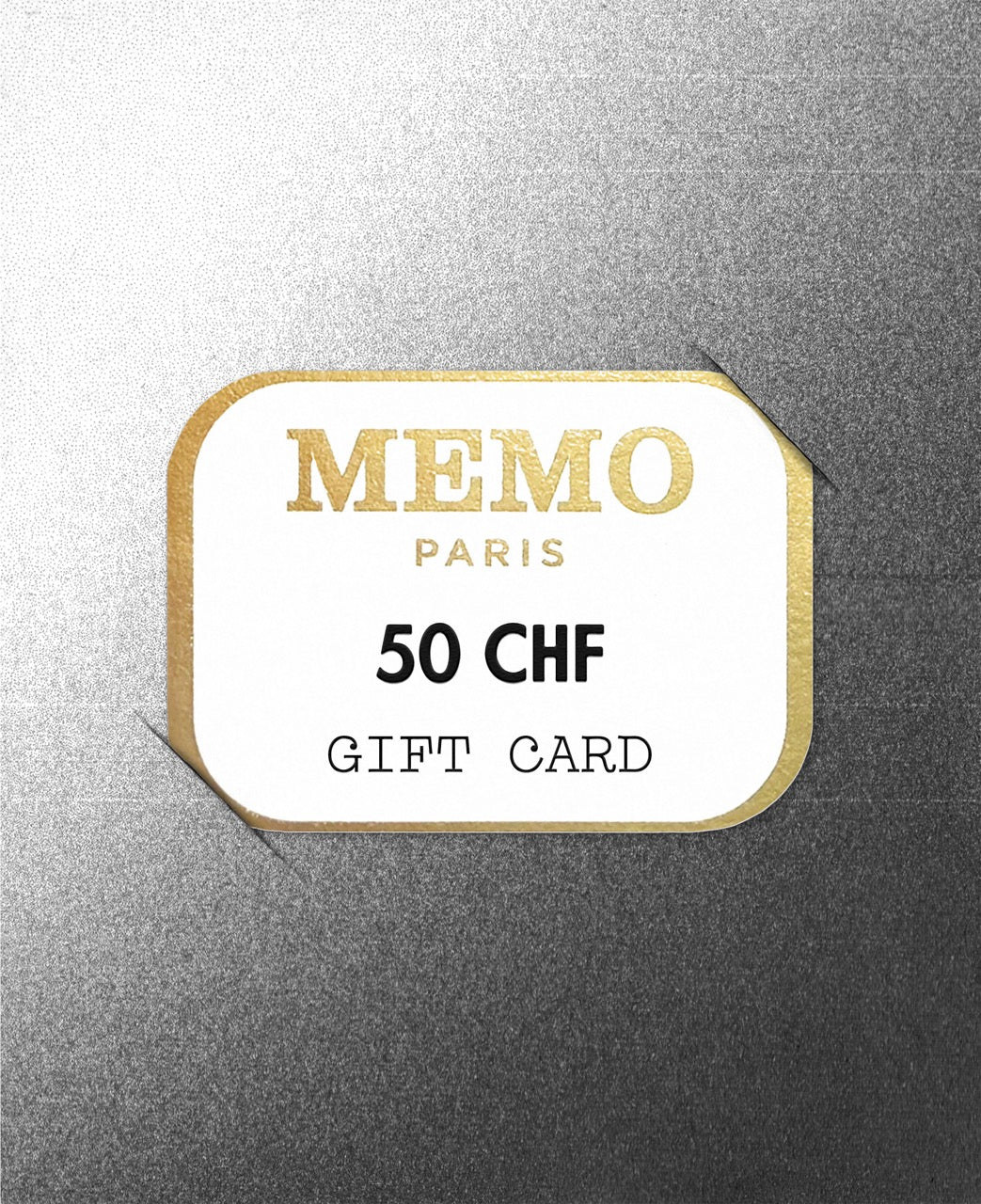 A white and gold memo paris gift card with embossed lettering and 50 chf for celebrating dream destinations