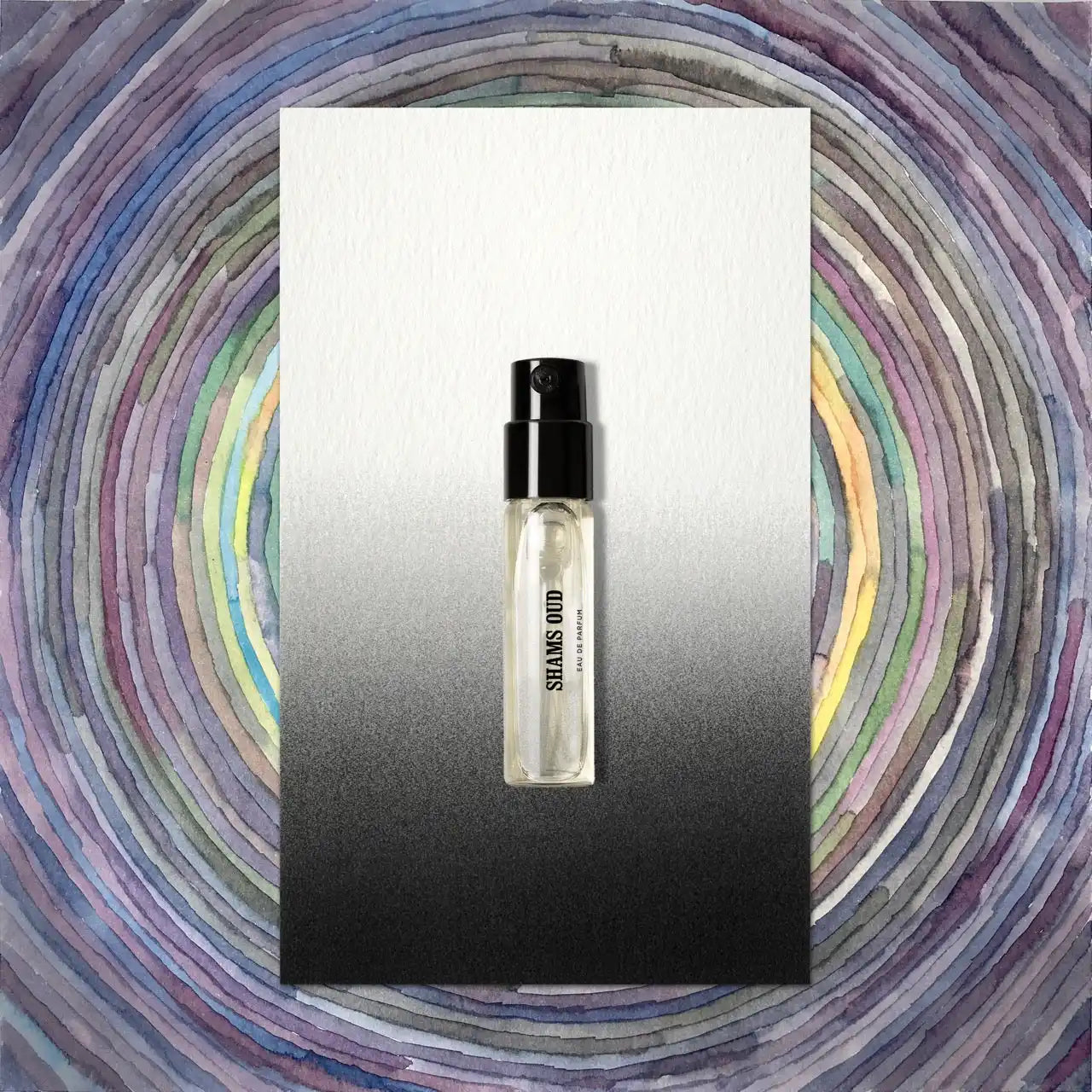 Perfume sample with black cap.