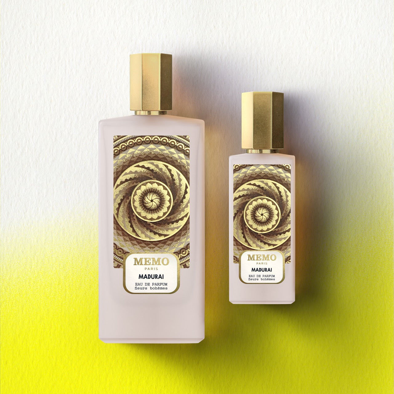 Two translucent pink perfume bottles with gold caps and spiral labels of memo paris signature duet madurai 30ml and 75ml — vue alternative
